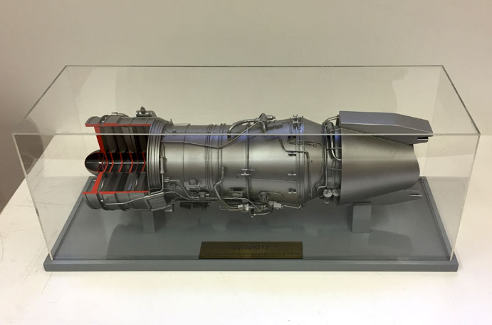 The model of the D-30KP2 engine under the protective cap of Plexiglas