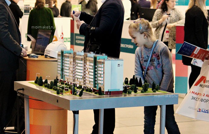 Real estate fair with model