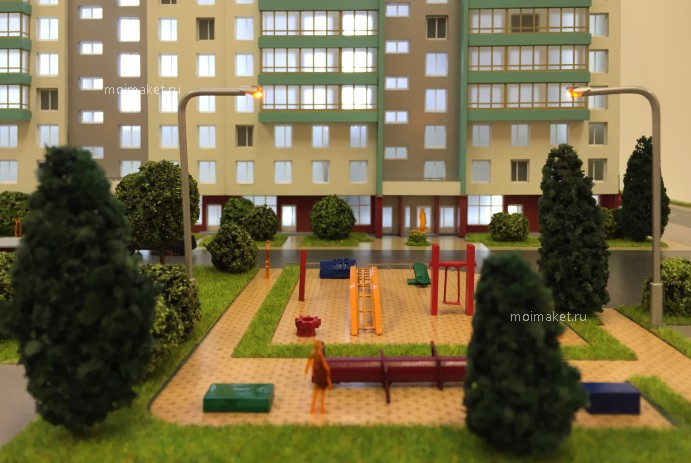 Model of the house with children's playground