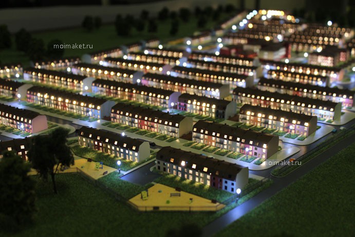 Illuminated model of townhouses