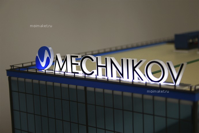 логотип с подсветкой на макете mechnikov