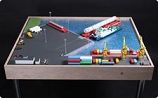 макет морского порта с баржей и буксиром